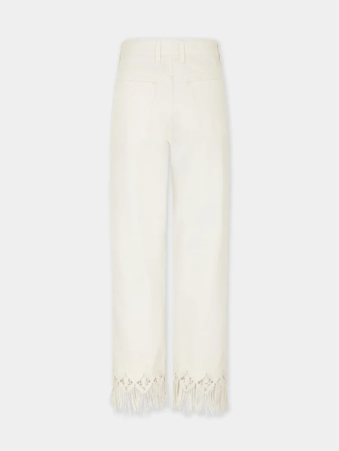 Byxor i denim med broderade detaljer