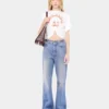 Utställda jeans prydda med 1969-skivor