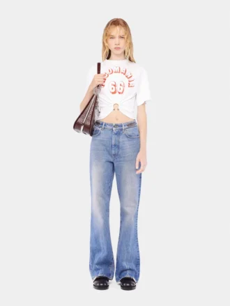 Utställda jeans prydda med 1969-skivor