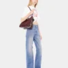 Utställda jeans prydda med 1969-skivor
