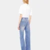 Utställda jeans prydda med 1969-skivor