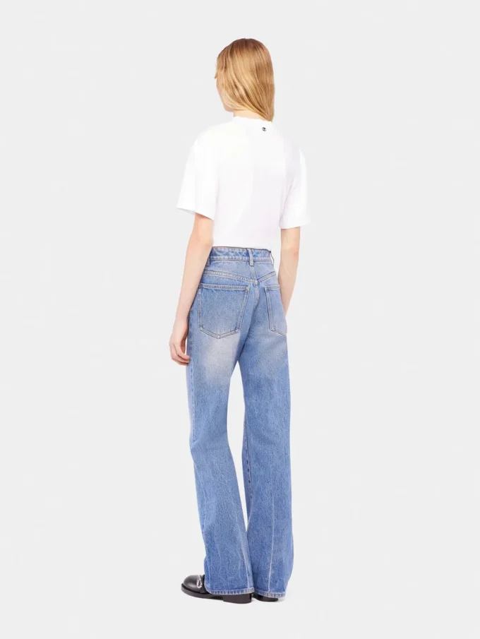 Utställda jeans prydda med 1969-skivor