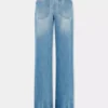 Utställda jeans prydda med 1969-skivor