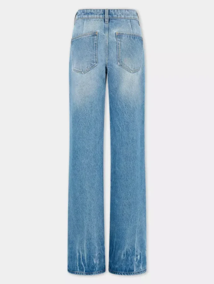 Utställda jeans prydda med 1969-skivor